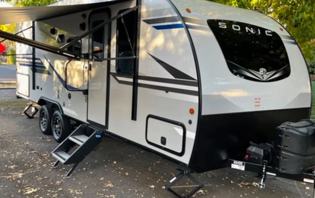 RV Share has a furnished 2022 Venture RV Sonic RV that sleeps four on a 27-foot-long travel trailer for rent in July at $125 a night.