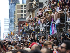 Spectators take in the view from scaffolding for the Toronto Pride Parade as it returns after two-year hiatus to downtown Toronto, Ont. on Sunday June 26, 2022. Ernest Doroszuk/Toronto Sun/Postmedia